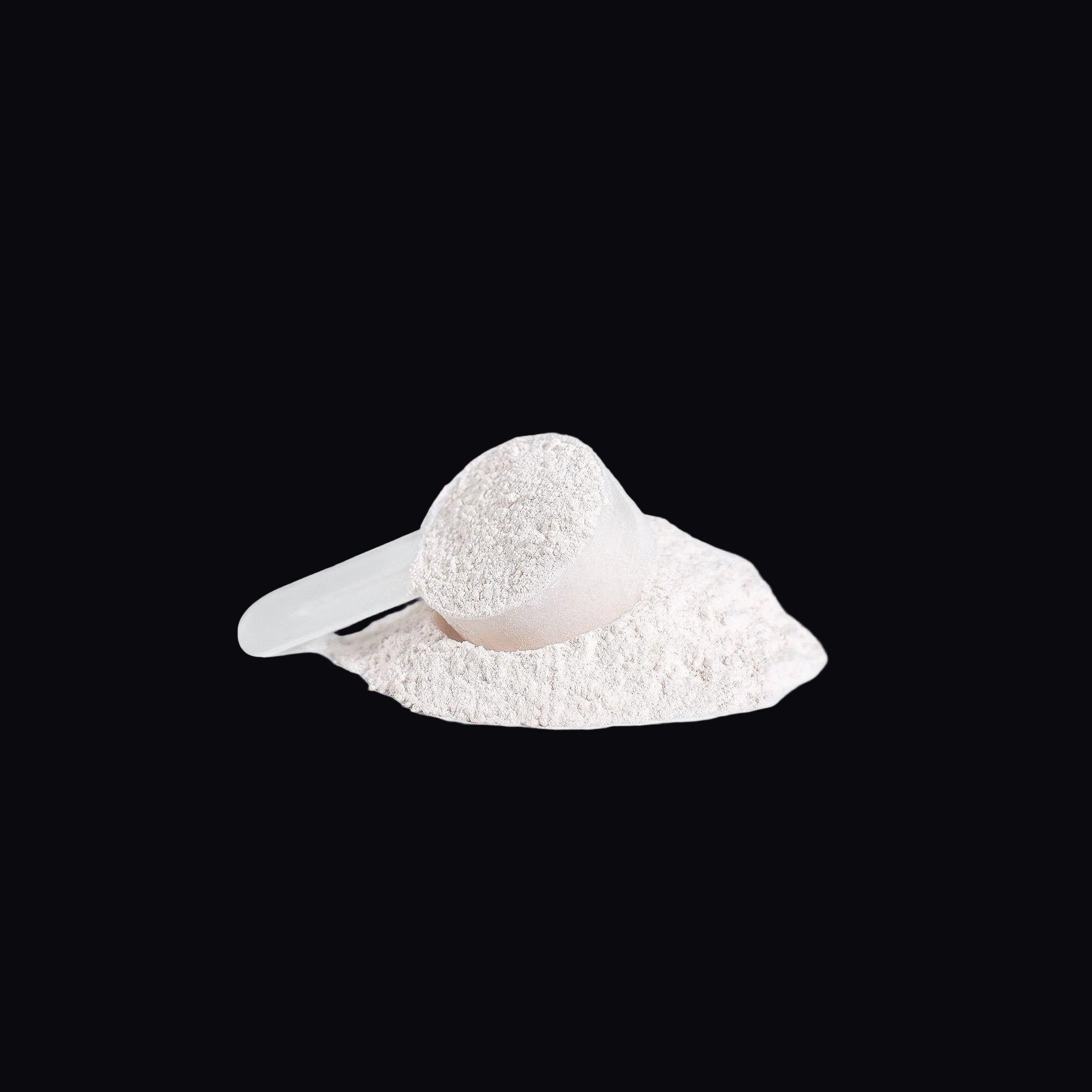 Close-up of pink BCAA powder texture with scoop - Instantized for rapid hydration and mixing.