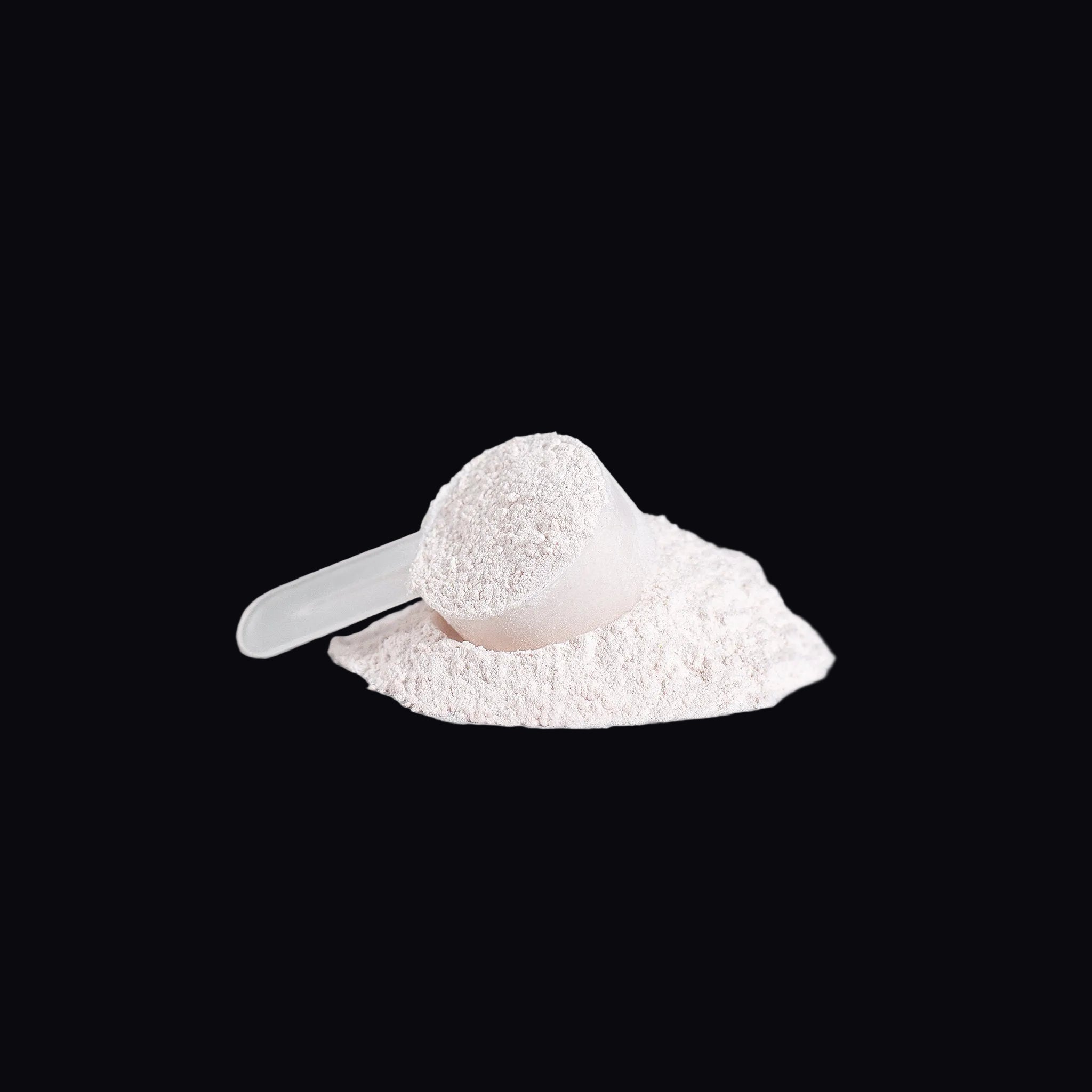 Close-up of pink pre-workout powder texture with scoop - AMBROSIA Nitric Shock Fruit Punch.